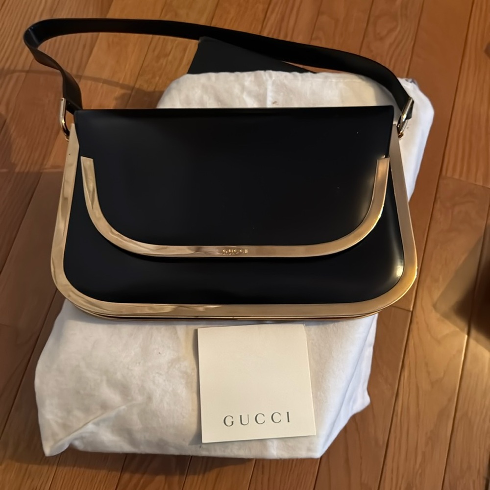 Gucci, black leather and gold hardware new handbag